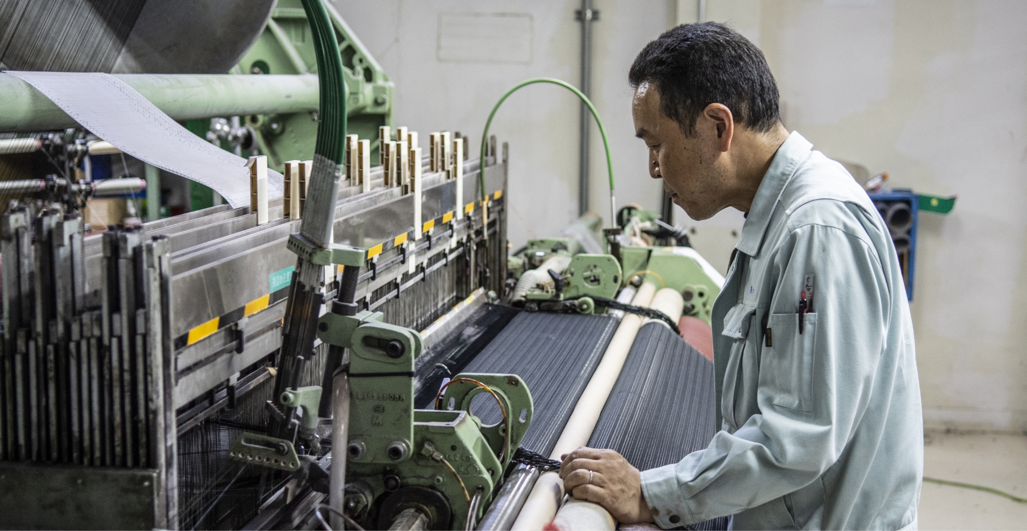  A large weaving machine making mesh