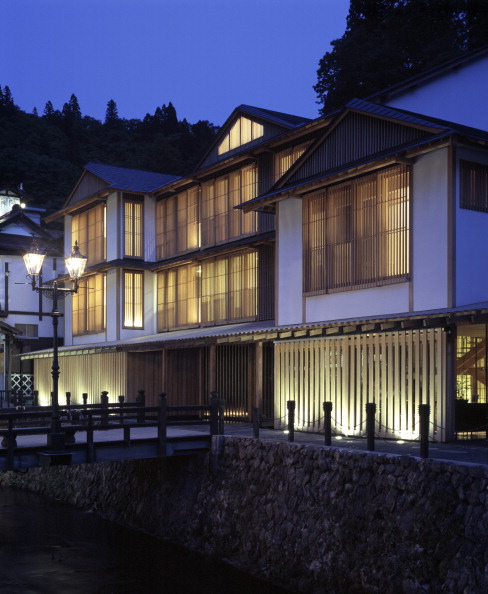 Ginzan Onsen Fujiya, Yamagata, Japan, Architect Kengo Kuma & Associates, Ginzan Onsen Fujiya Overall Exterior View At Twilight. (Photo by View Pictures/UIG via Getty Images)