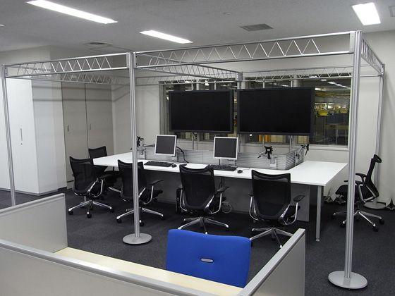 All Nippon Airways Co., Ltd. (ANA)/【Office area】(PHQ Area) Production Headquarters ANA and two affiliates comprehensively manage production from this space. Management is conducted with the lower-level maintenance facility while conducting monitoring.  The space incorporate symbolic trusses. 