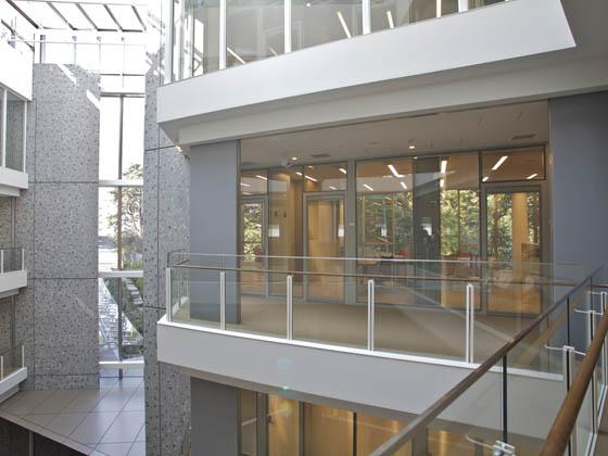 Ambassade de France au Japon/【Office area (from the hallway)】The building makes ample use of glass and strives for harmony with nature.