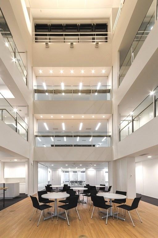 Origin Electric Co., Ltd./【Ecovoid （Technical Head Office）】The four-story open-ceiling space serves as an "interaction space" connected to all works spaces.